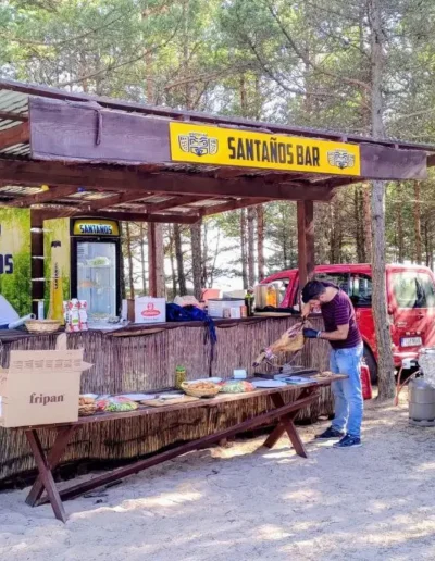 Outdoor showcooking setup with chef grilling food at a corporate event in Saaremaa