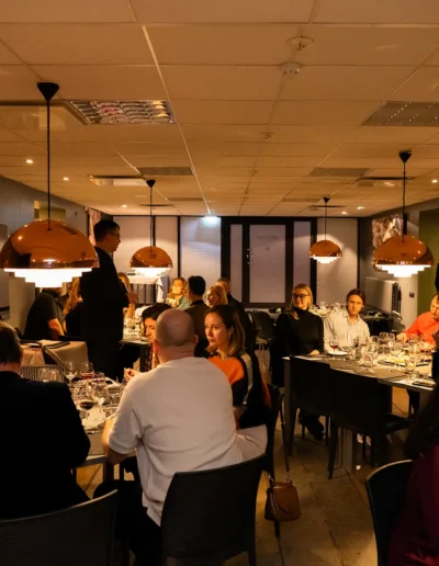 Guests enjoying dinner and wine at an institutional event in Tallinn