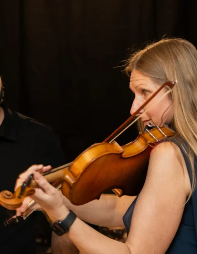 Violinist playing live music during a private event in Tallinn